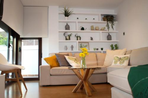 a living room with a couch and a table at VILLA TAZA DE PLATA A in Huétor Vega