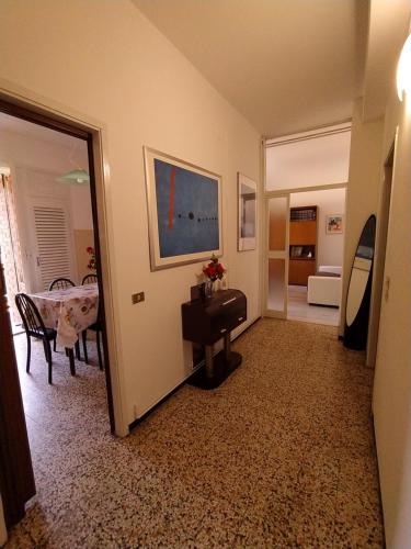 a living room with a table and a dining room at Appartamento Il Sogno in Bellano