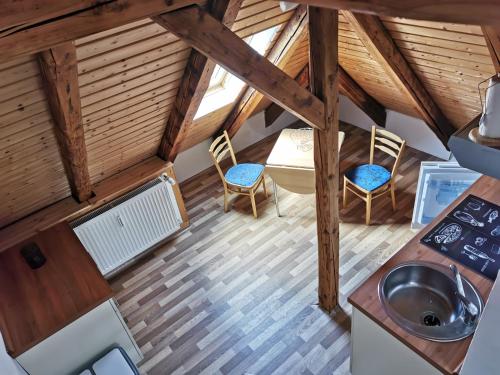 a view of the kitchen and dining room of a tiny house at Anhalter Berg in Quedlinburg