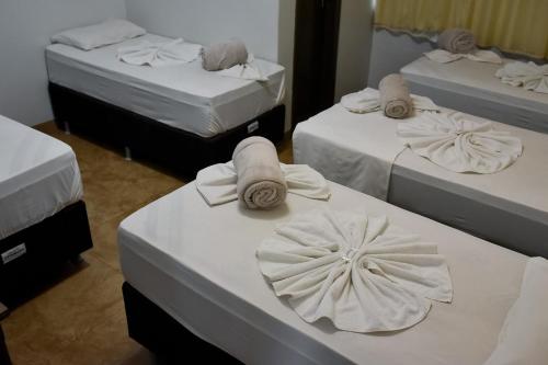 Cama ou camas em um quarto em Tangará Hotel