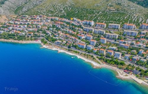 an aerial view of a town on the shore of the water at Apartments Luka in Senj