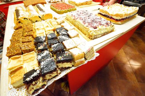 a table with many different types of cakes on display at Apartamenty Willa Anna in Poronin