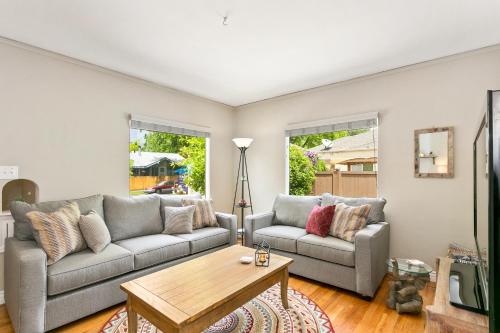 a living room with two couches and a coffee table at North End Cottage in Boise