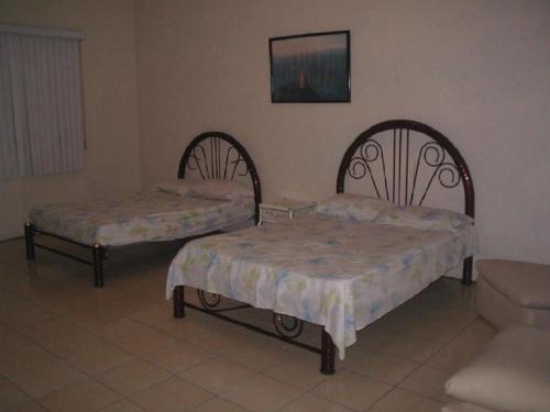 Casa Circuito del Lago tesisinde bir odada yatak veya yataklar