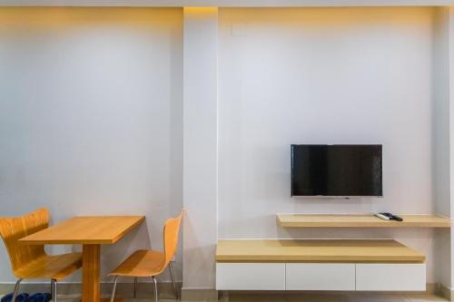 TV a/nebo společenská místnost v ubytování GEM Apartment