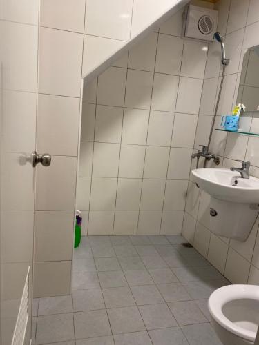 a bathroom with a sink and a toilet at 琉漾民宿 in Xiaoliuqiu