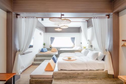 Ένα ή περισσότερα κρεβάτια σε δωμάτιο στο Krung Boutique Hotel