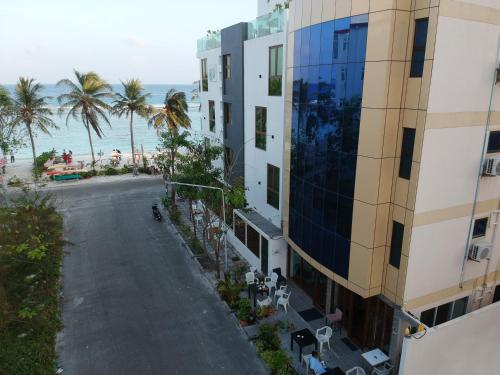 an aerial view of a building and the beach at Turquoise Residence by UI in Hulhumale