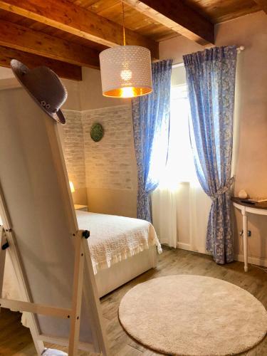 a bedroom with a bed and a window at Az. Agr. Parco dei Buoi in Larino