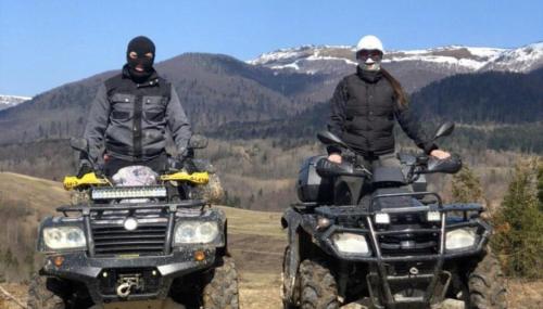 two people riding on atvs in the mountains at Beregynia in Zhdenievo