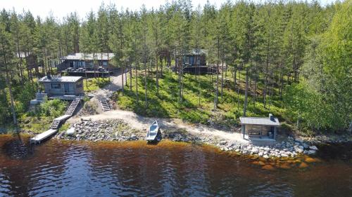 an aerial view of a house on an island in the water at Villa Ukkoteeri in Savonranta