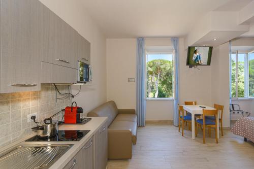 Kuchyň nebo kuchyňský kout v ubytování Hotel Sogno