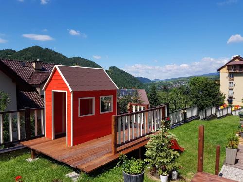 a tiny house on a deck in a yard at Pieninski Mak. in Szczawnica
