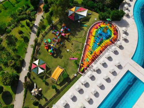 an overhead view of an amusement park with a roller coaster at Kefaluka Resort in Akyarlar