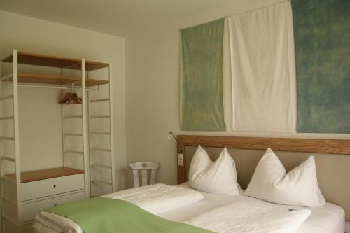 En eller flere senge i et værelse på Residence die Färbe