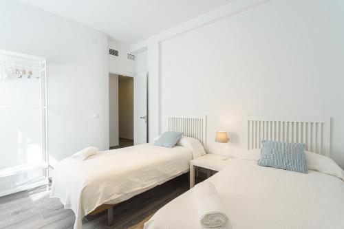 Posteľ alebo postele v izbe v ubytovaní CASANA APARTAMENT CITY CENTER