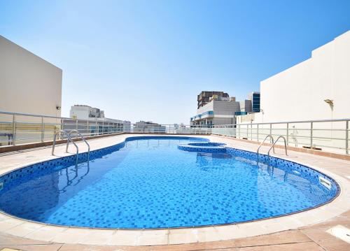 a large swimming pool on the roof of a building at KeyHost - Frankfurt 1307 in Dubai