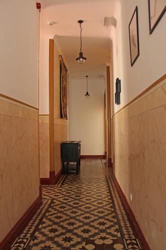 an empty hallway with a tile floor in a building at A CASA DA VILA in Almodôvar