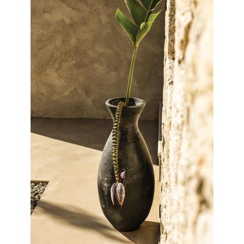 a black vase with a plant in it at Mimi and Coco Villas Corfu in Paramonas