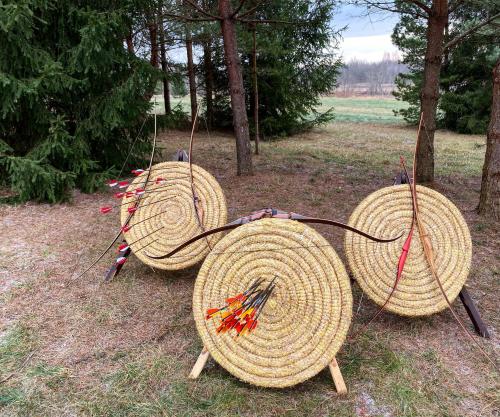a group of straw baskets sitting on the grass at Atpūtas parks Priežvanagi in Livža