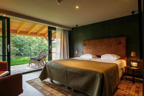 En eller flere senge i et værelse på Van der Valk Hotel Apeldoorn - de Cantharel