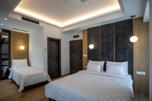 Postel nebo postele na pokoji v ubytování Grand Central Hotel