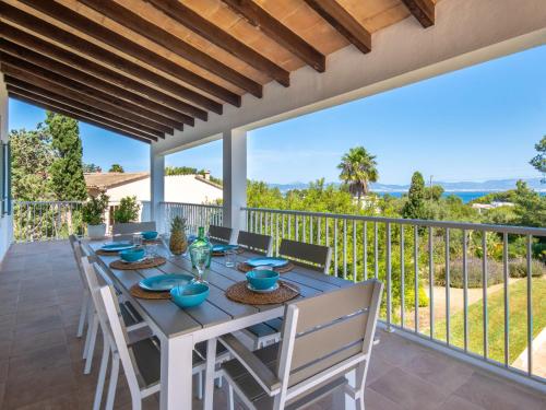 a dining table and chairs on the balcony of a house at Villa Son Granada by Interhome in Cala Blava
