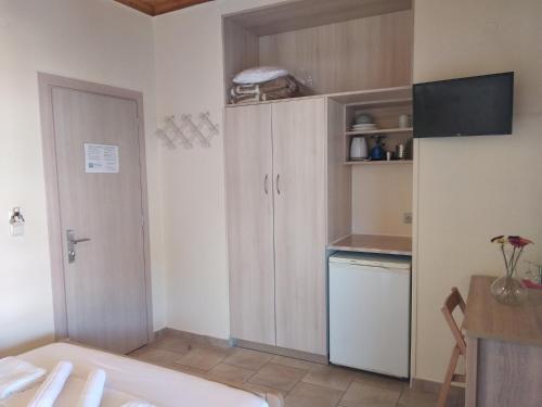 Kuchyň nebo kuchyňský kout v ubytování Gogo's - Γωγώ Rooms & Studios