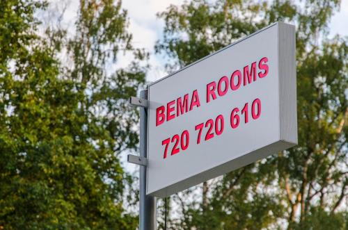 a sign for abinaria rooms crore at Bema Rooms in Łódź