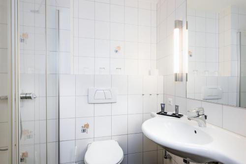 Phòng tắm tại Hapimag Ferienwohnungen Flims