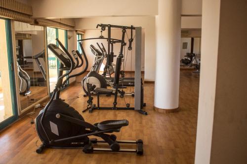 a gym with several exercise bikes in a room at Green Sudr Resort in Ras Sedr