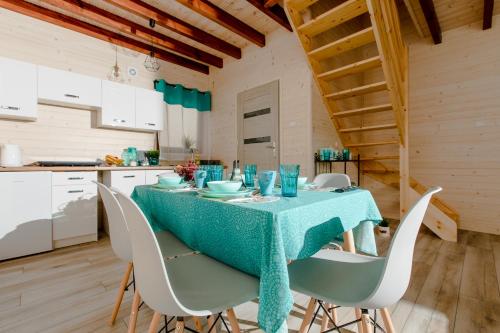 a dining room with a table and chairs at Molo Resort in Niechorze