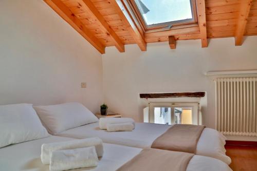 Säng eller sängar i ett rum på Contempora Apartments - Ca' Brenta Attic