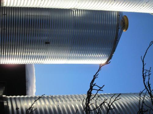 a close up of a metal building with the sky in the background at SiloStay in Little River