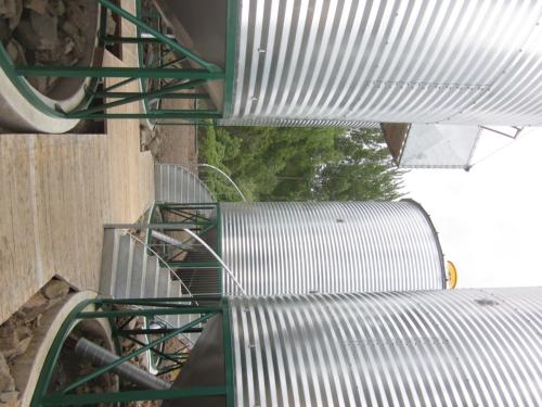 a metal staircase leading up to a train station at SiloStay in Little River