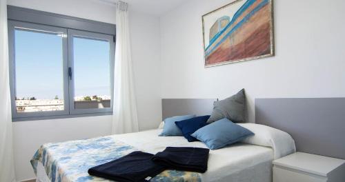Ένα ή περισσότερα κρεβάτια σε δωμάτιο στο Apartamentos Conil Park
