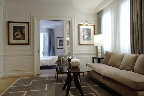 a living room with a couch and a table at Lungarno Luxury Apartments - by Lungarno Collection in Florence