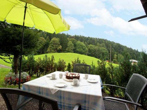 a table with a cake sitting on top of it at Chalet Monika in Sankt Koloman