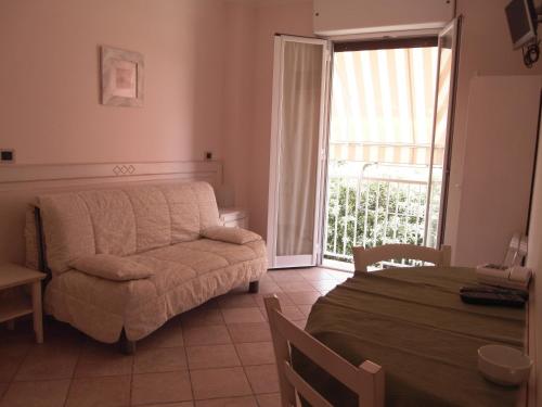 a living room with a couch and a table at Residence Panama in Alassio