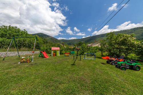 a park with a swing and a playground at Apartments Pelle in Tivat