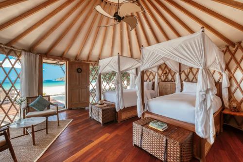 a bedroom with two beds in a yurt at Awei Pila (Mergui Archipelago) in Kyun Pila Island.
