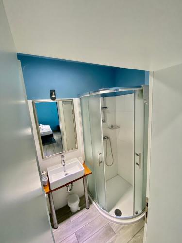 a bathroom with a sink and a shower at Iris Studios in Umag