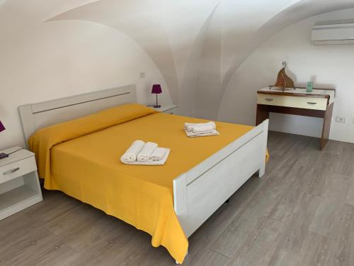 Säng eller sängar i ett rum på Monolocali a Palazzo Rizzelli