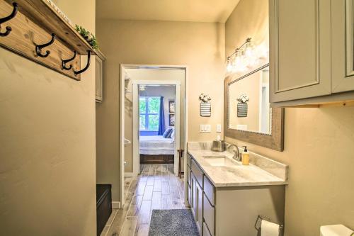 a bathroom with two sinks and a mirror at Hill Country Escape Hike, Swim, and Drink Wine in Fredericksburg