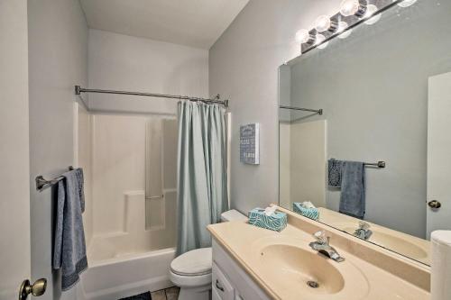 a bathroom with a sink and a toilet and a shower at Modern Home with Patio and Grill in Cape Coral! in Cape Coral