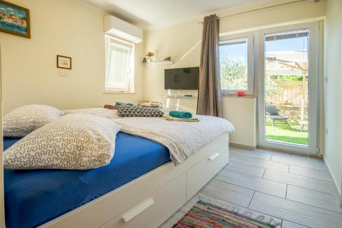 Postel nebo postele na pokoji v ubytování Apartments Apartim Piran