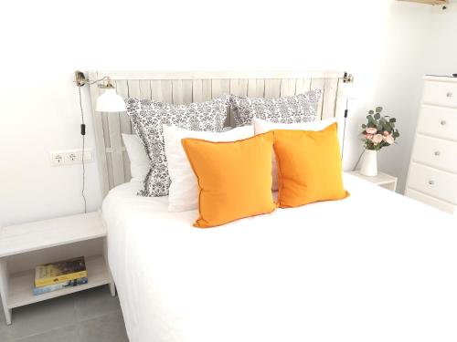A bed or beds in a room at La Siesta Malaga Guesthouse