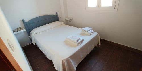Posteľ alebo postele v izbe v ubytovaní Casas Turísticas Bajamar