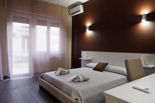 Postel nebo postele na pokoji v ubytování B&B Leus Appartment
