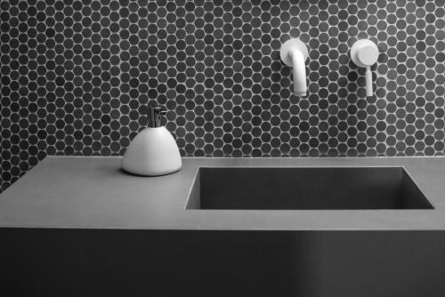 a bathroom sink with a soap dispenser on it at Ambeli Luxury Villa in Megalokhori